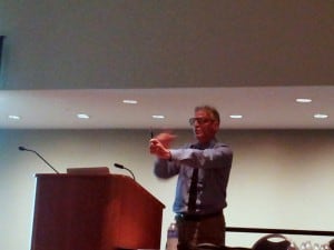Richard Ivry demonstarting the prism glasses effect at the APA 2014 meeting; credit: Lisa M.P. Munoz